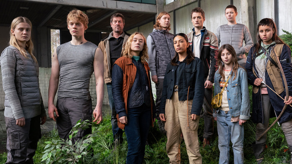 a group of people standing together outside a building a group of people standing together outside a building