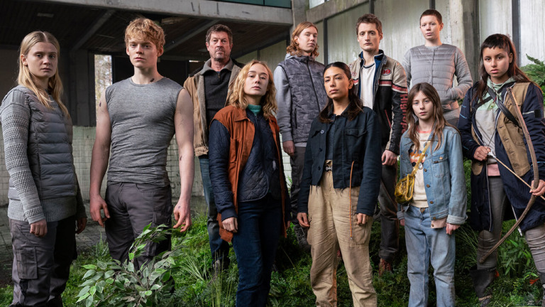 a group of people standing together outside a building