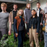 a group of people standing together outside a building